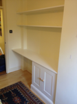 bedroom shelves, desk surface and cupboard